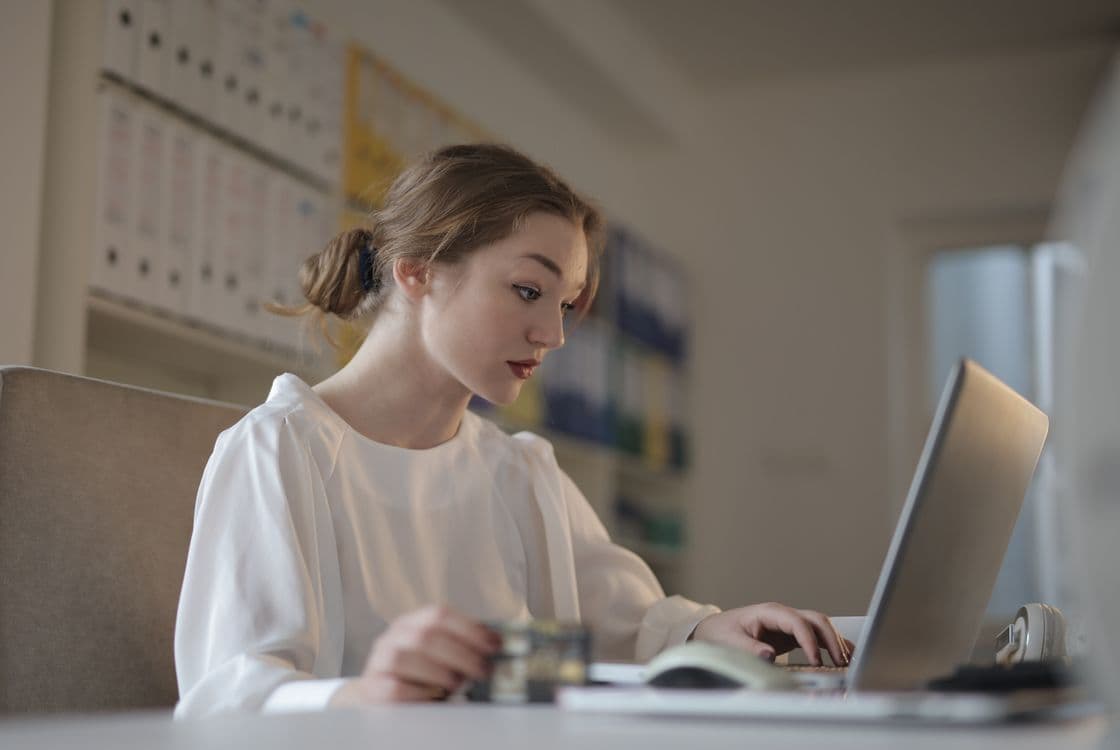 Accountant working on bookkeeping using a laptop