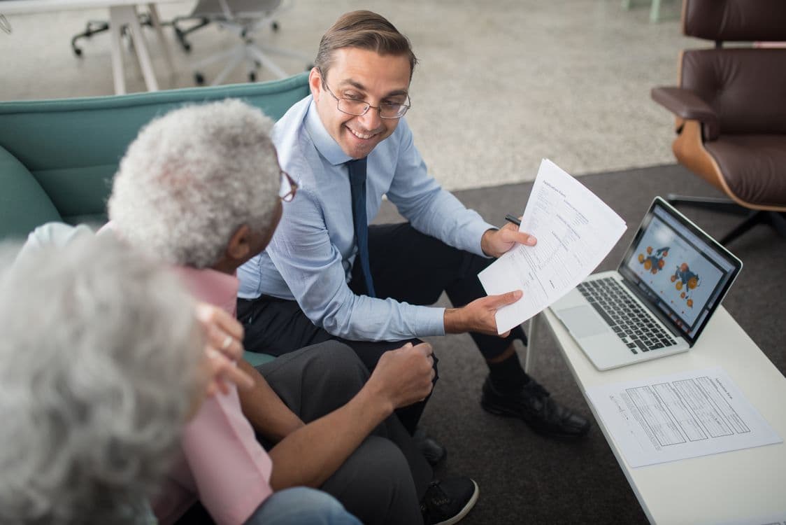 Advisor discussing retirement account documents with a client
